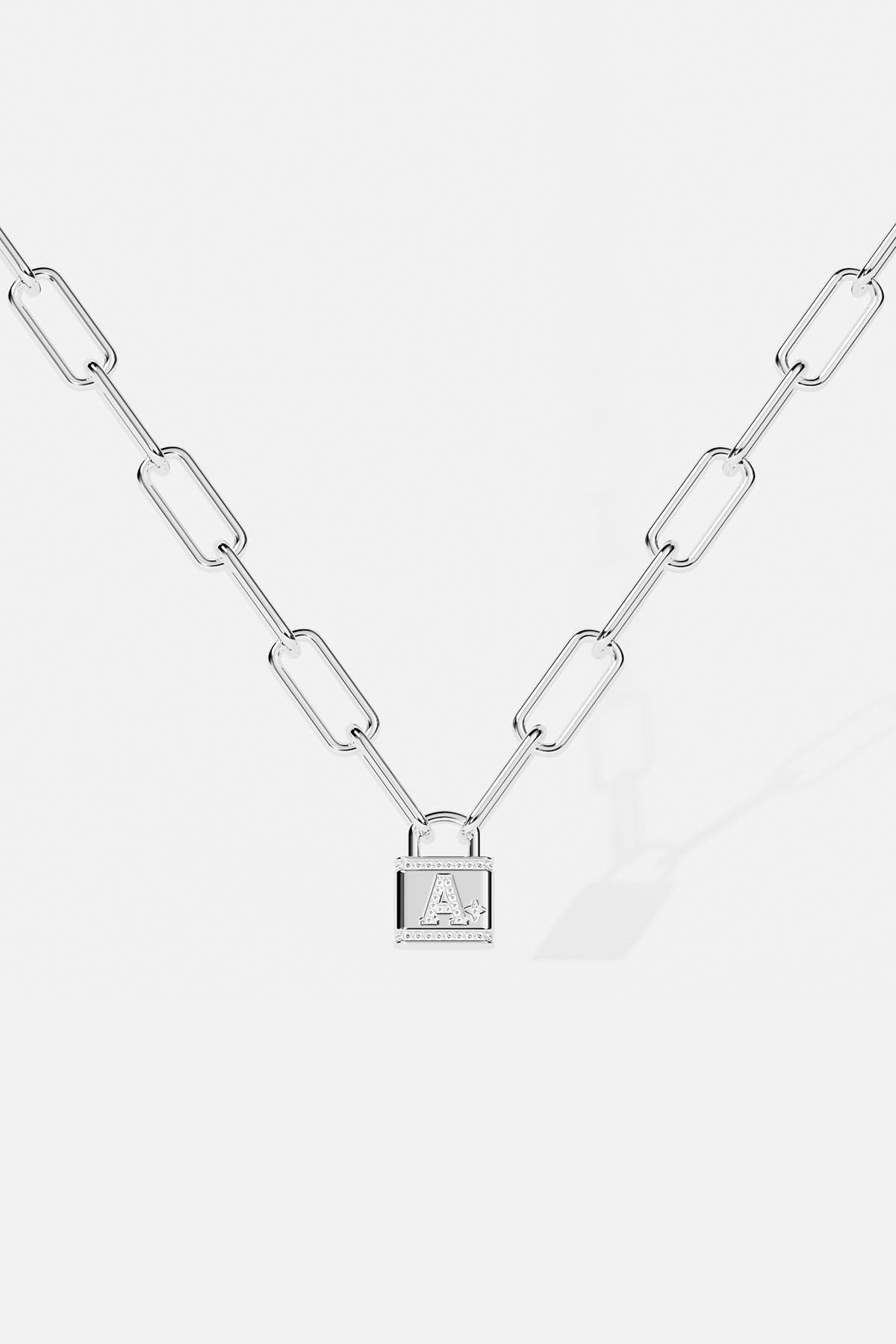 Necklaces APM Monaco: white chain with oval links and a lock-shaped pendant engraved with the letter A.