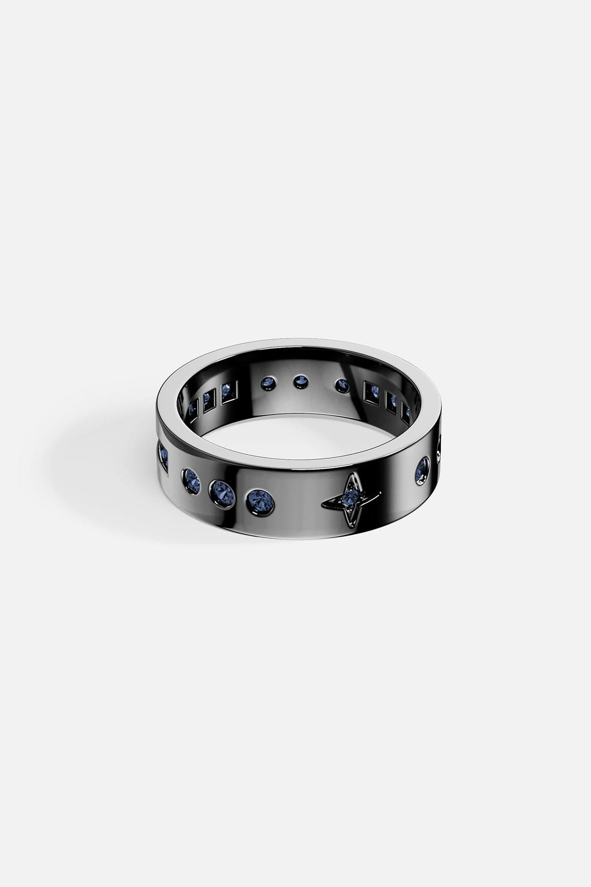 alloy ring with embedded stones on a white background