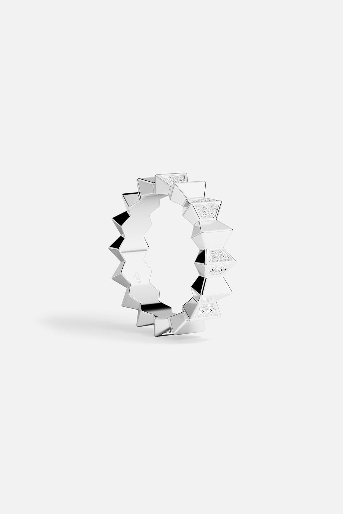 Silver-tone ring with geometric design on a white background