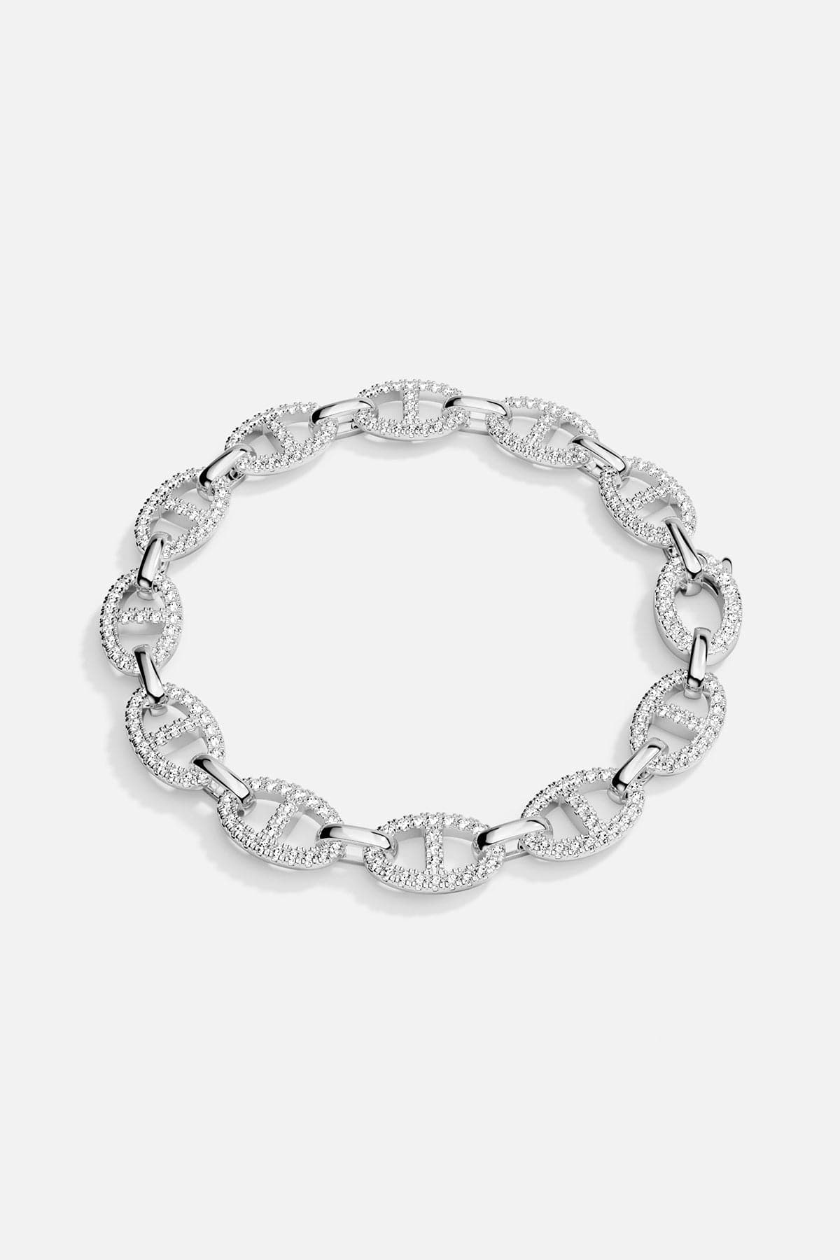 Silver bracelet with interlocking links on a light gray background