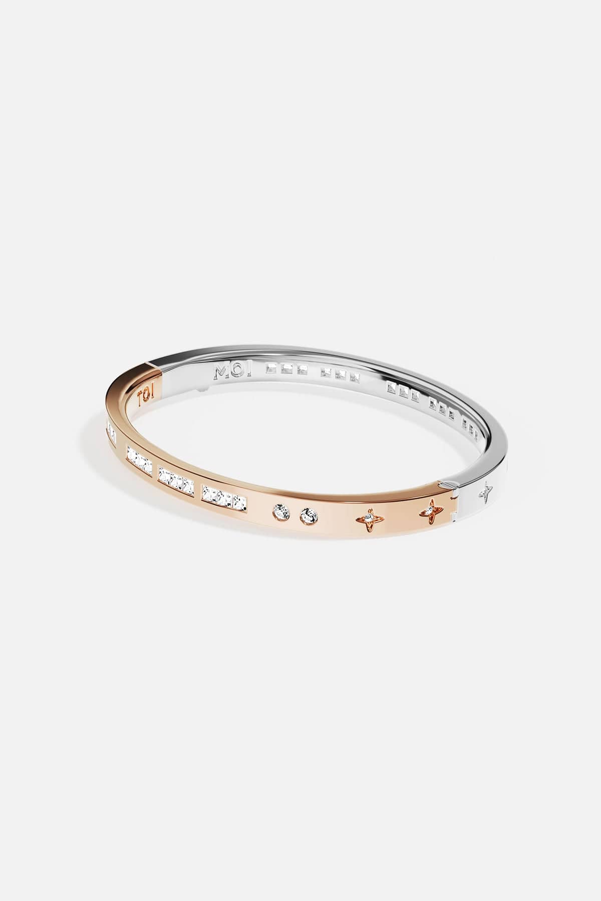 Bangle with rose gold and silver accents on a white background