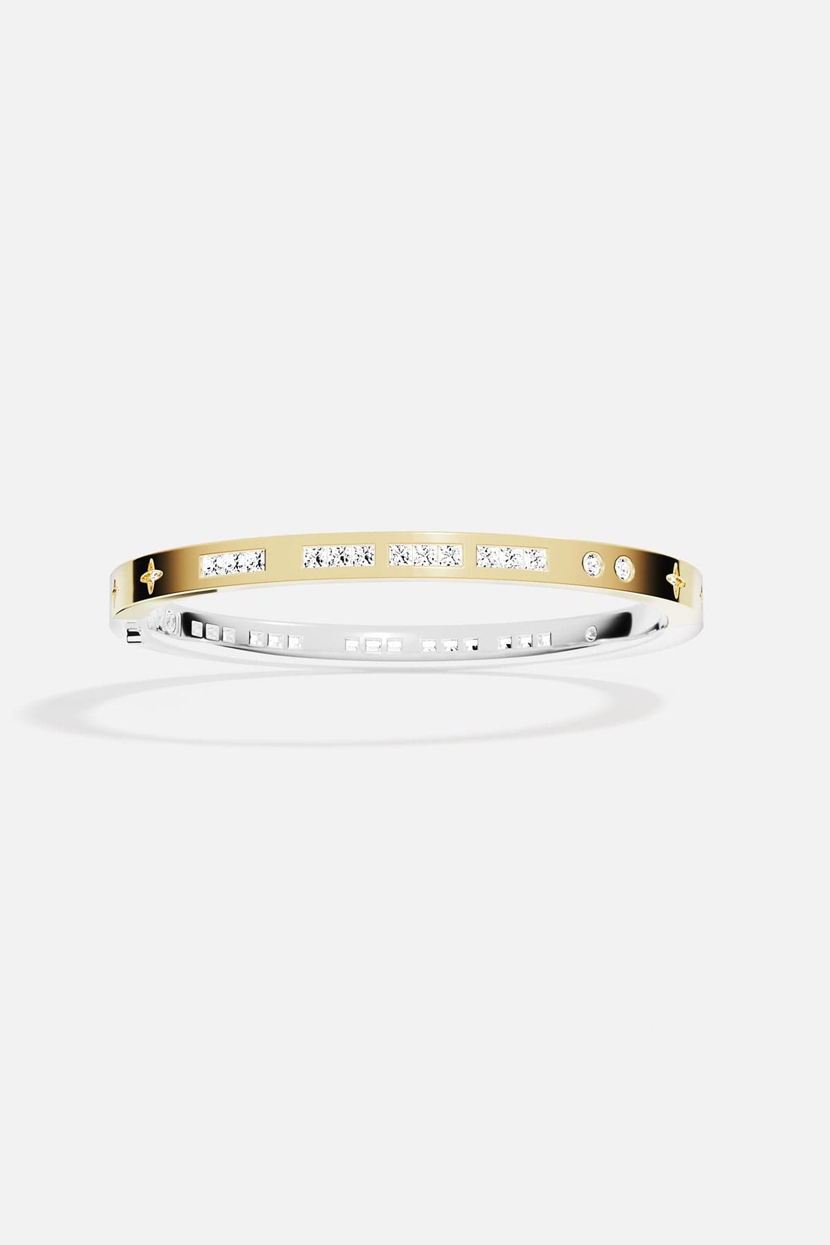 Gold bracelet with small stones on a white background