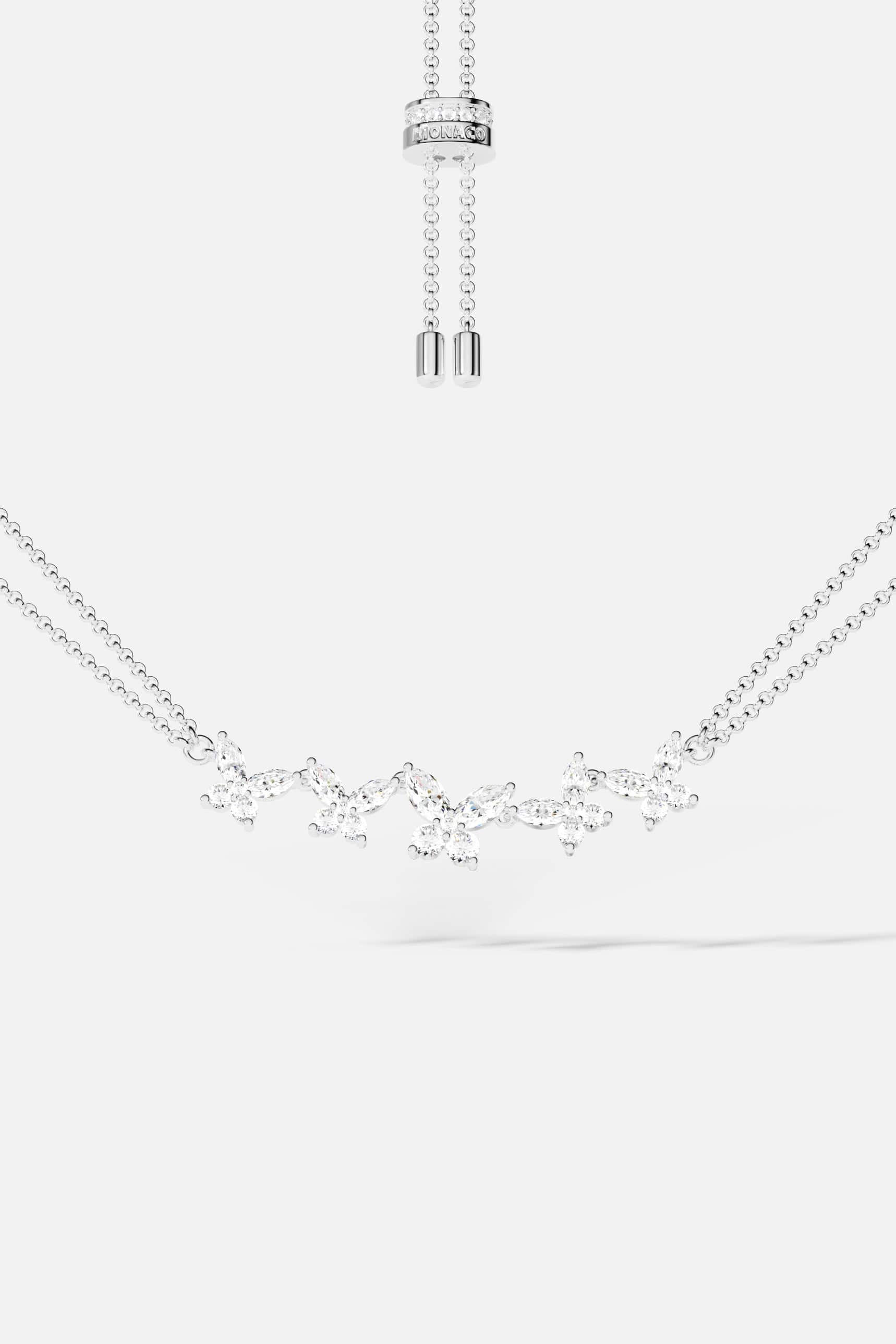 Necklaces APM Monaco: butterfly-pattern necklace with cubic zirconia on a double-chain, adjustable length in silver-tone metal.