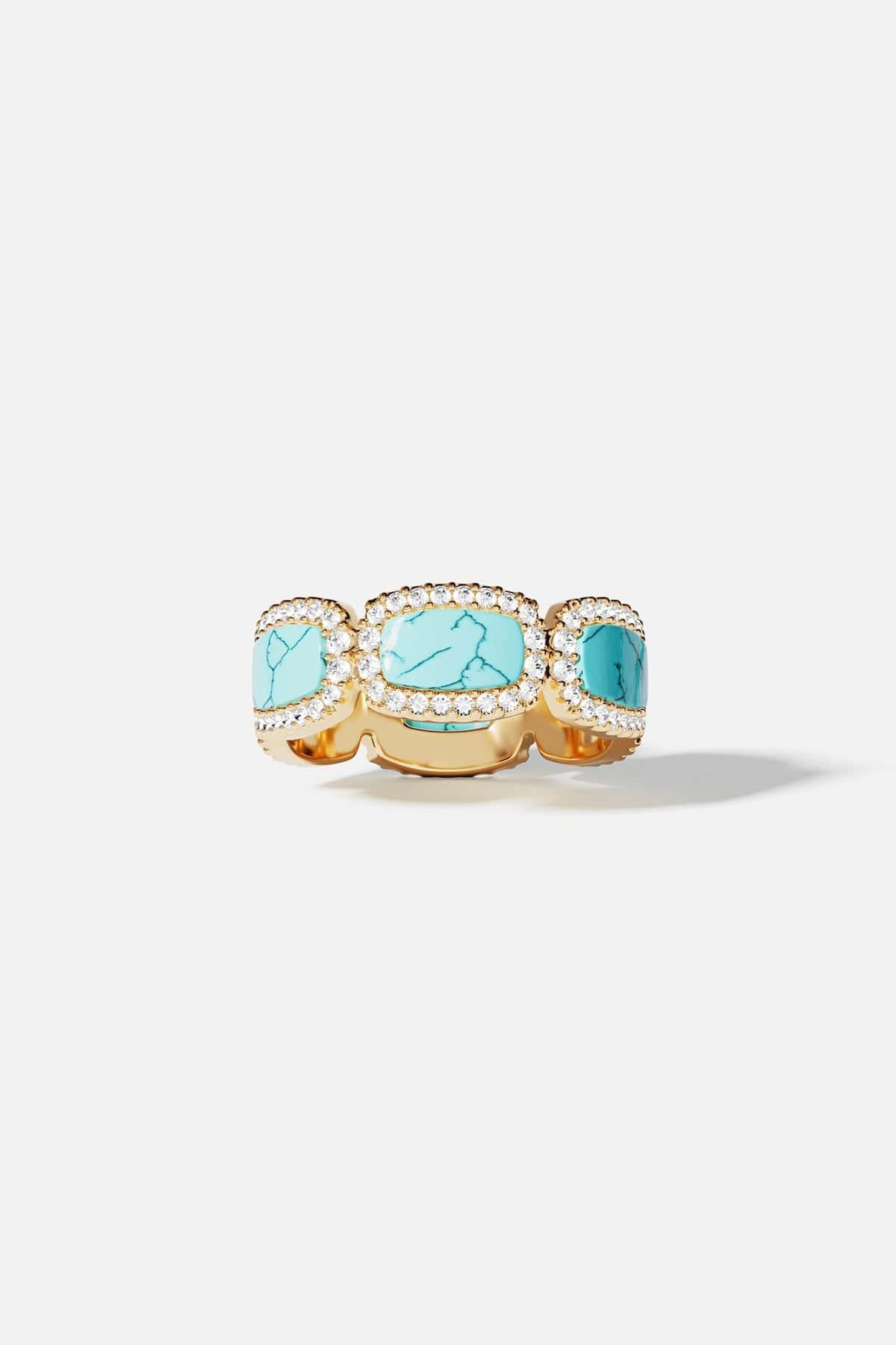 Ring, APM Monaco: yellow gold ring with three Lagoon turquoise stones, each surrounded by a halo of small white diamonds.
