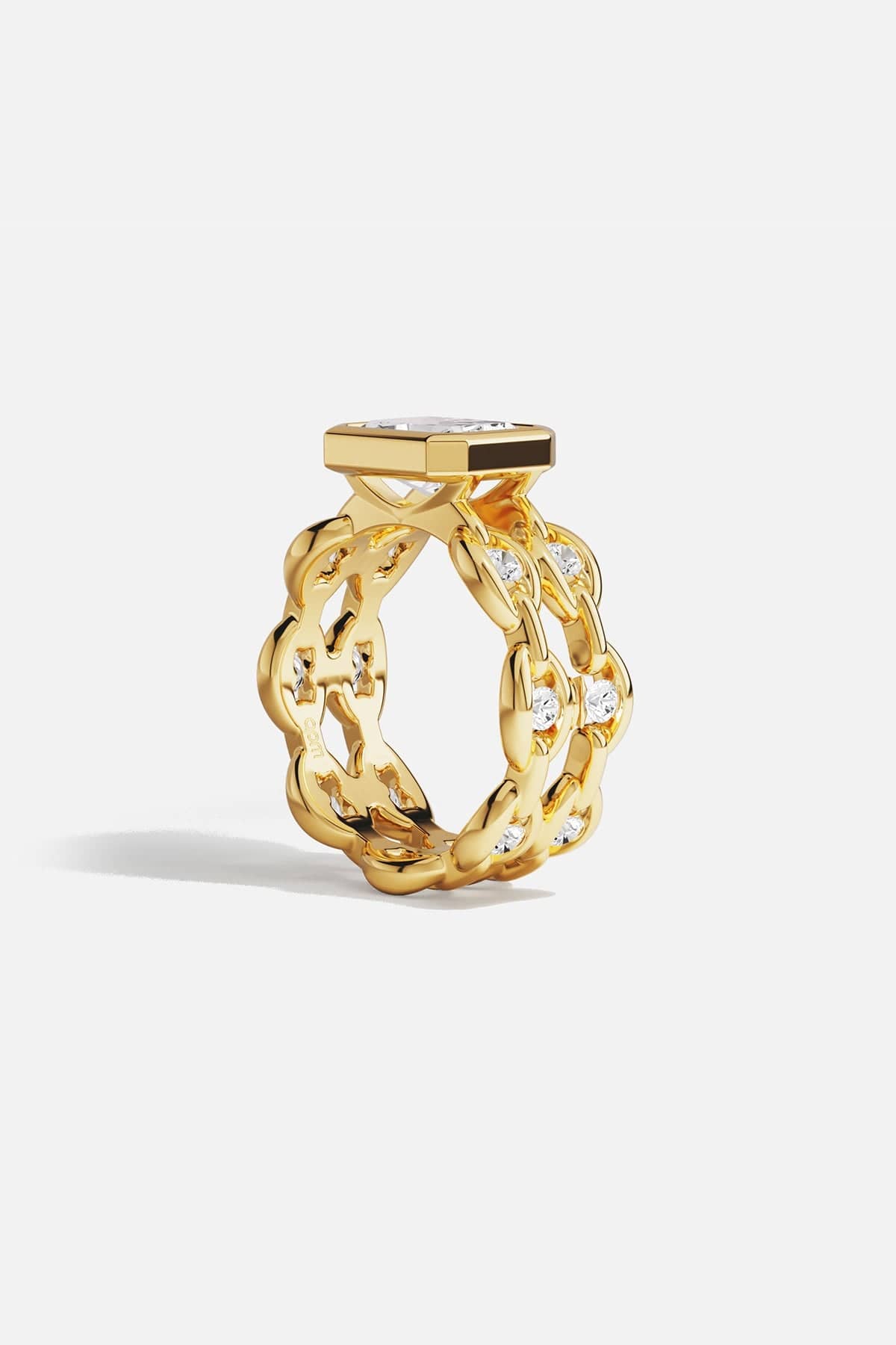 Rings APM Monaco yellow gold statement ring with a large square-cut white center stone surrounded by a pavé halo of smaller stones.