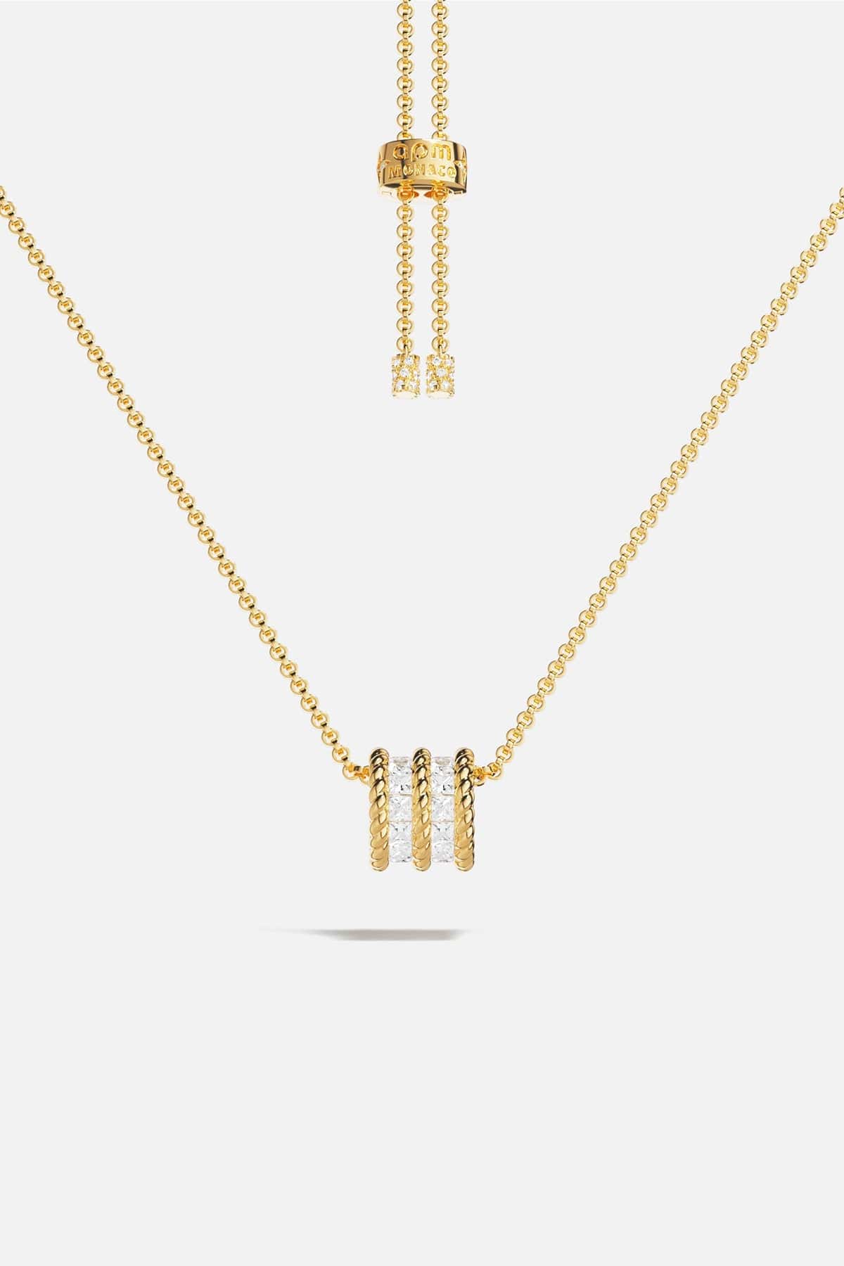 APM MONACO yellow gold adjustable necklace with white stones on a white background