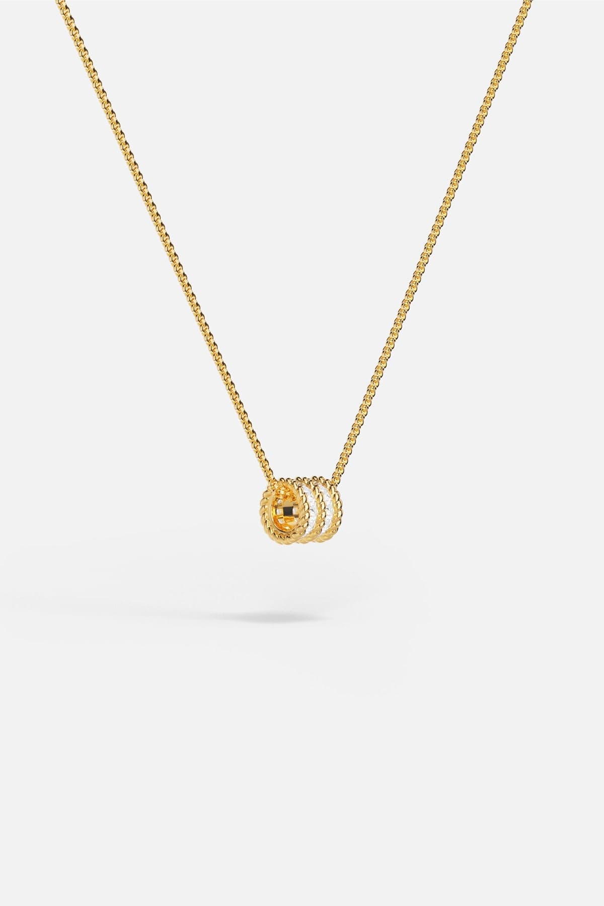 APM MONACO yellow gold adjustable necklace with white stones on a white background